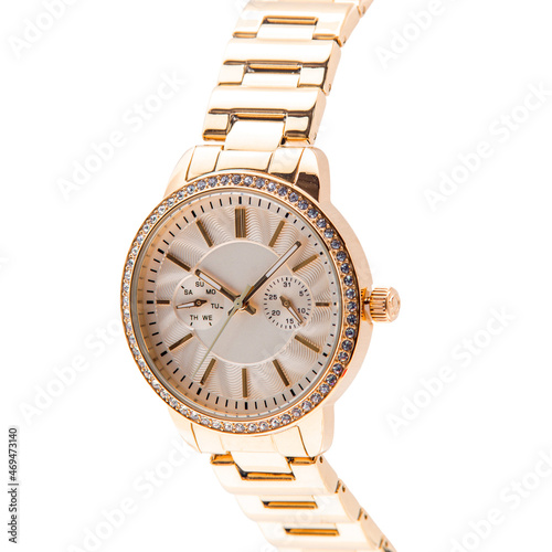 Wrist watch is gold color on white background.