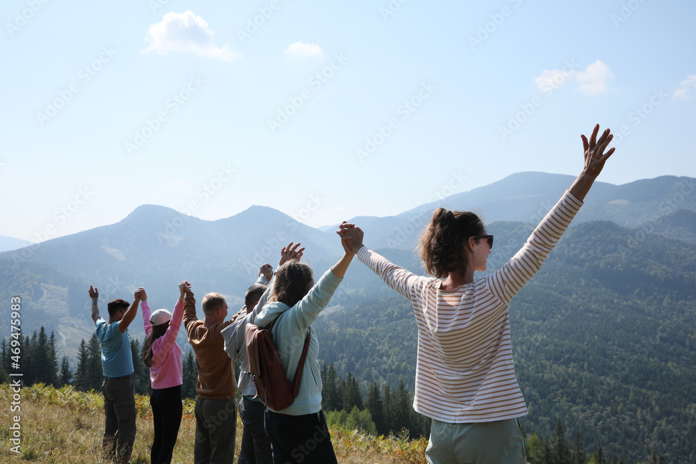 Group of people spending time together in mountains Group of people spending time together in mountains