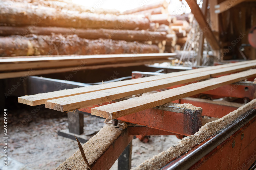 Sawmill. Wooden planks at a sawmill or in a carpentry workshop. Sawing, drying wood Sawmill. Wooden planks at a sawmill or in a carpentry workshop. Sawing, drying wood
