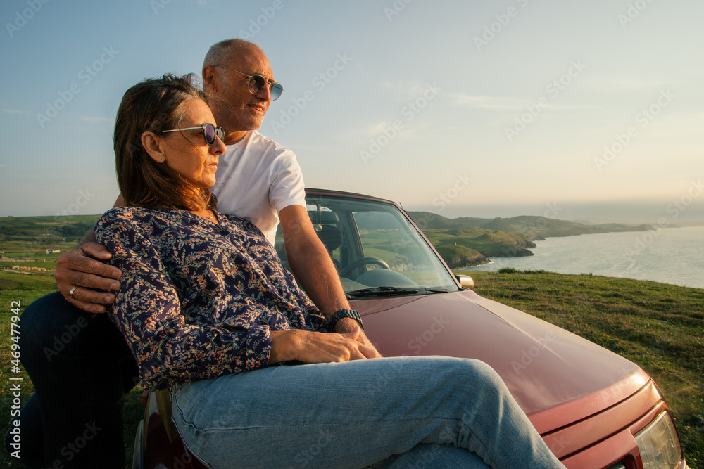 Aged couple enjoying their retirement holidays on the coast