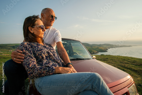 Aged couple enjoying their retirement holidays on the coast