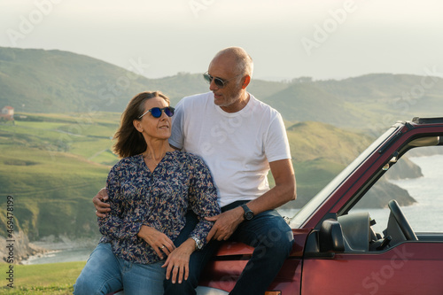 Aged couple enjoying their retirement holidays on the coast