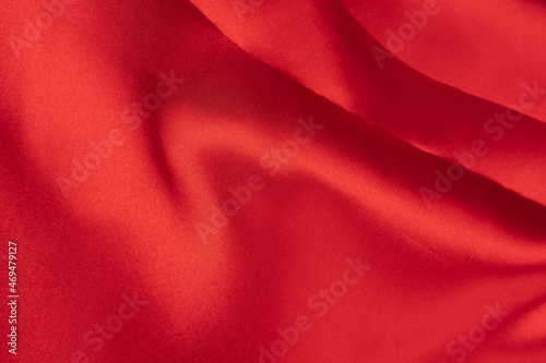 Wrinkled red silk or satin textile for elegance background, with copy space, Top view for design