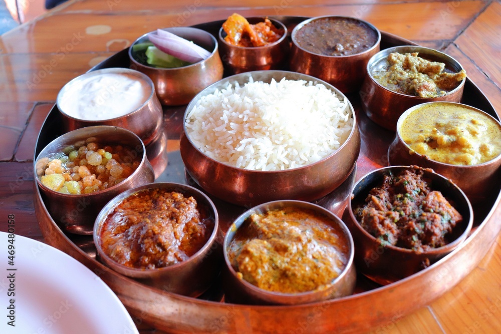 Dham - Traditional food of Himachal Pradesh. Himachali kangri dham thali includes Kaddu ka khatta, Chane ka Madra, sepu vadi, maash dal, Rajma, salad, rice, or Mitha Bhaat. served with Roti and pickle Dham - Traditional food of Himachal Pradesh. Himachali kangri dham thali includes Kaddu ka khatta, Chane ka Madra, sepu vadi, maash dal, Rajma, salad, rice, or Mitha Bhaat. served with Roti and pickle