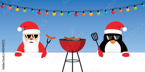 cute santa claus and penguin with sunglasses at christmas bbq