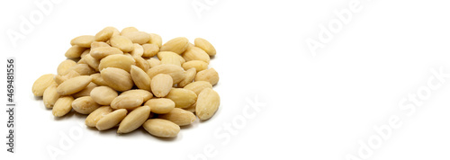Peeled almond kernel isolated on white background. Snack fresh nuts. Empty space for text. Copy space