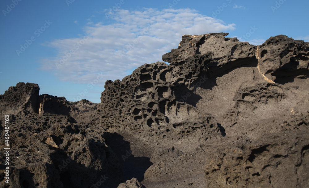 Porous lava volcanic rock around around Playa de la Concha beach in El Cotillo La Oliva municipality of Fuerteventura, Canary Islands
