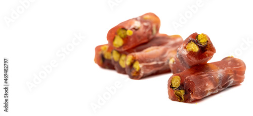 Turkish Delight isolated on a white background. Turkish delicacies with pomegranate and pistachio. Delight for snack. Empty space for text. Copy space