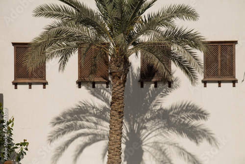 Doha,Qatar,05,10,2019. Old wooden windows in Arabic style on a traditional mud building in the market Souk Waqif.