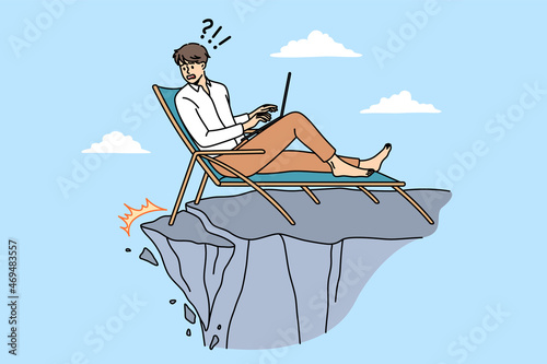Earthquake and feeling panic concept. Young businessman sitting in chair with laptop and looking at abyss of sudden danger earthquake vector illustration 