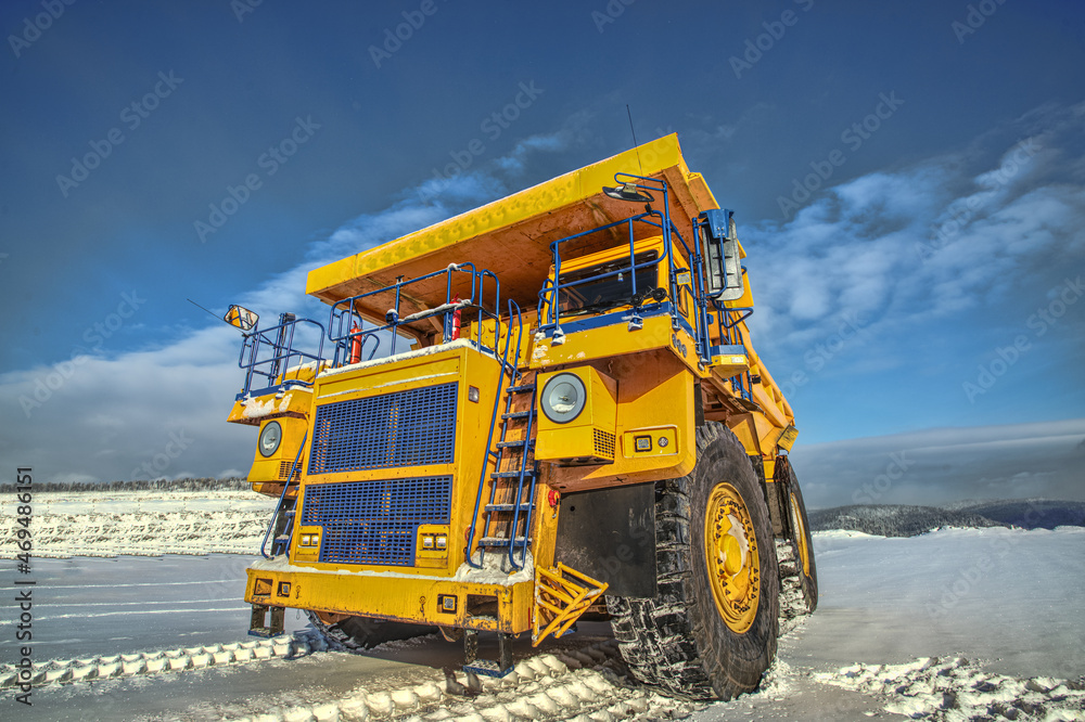 Big yellow dump truck in coal mine 