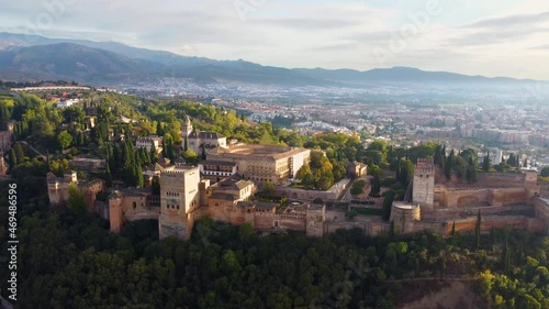 The medieval complex of Alhambra. Flying around Granada at sunrise, Spain, UHD, 4K photo