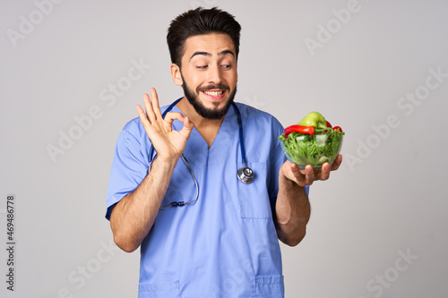 birth bearded male doctor plate with vegetables healthy food treatment calories