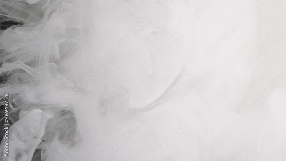 Space background. White ink is mixed in water on a black background. Amazing abstract white Space background. White ink is mixed in water on a black background. Amazing abstract white
