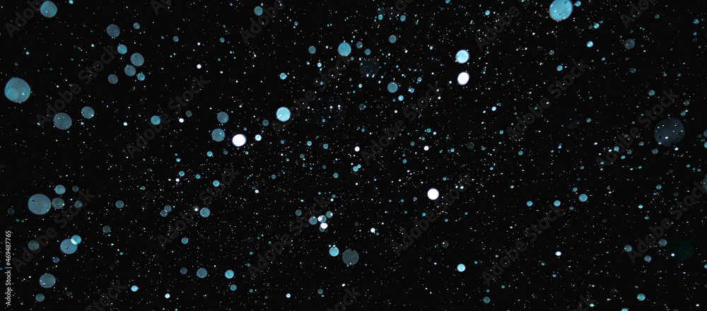 Blurred snowflakes on a dark background. Overlay image for snowfall effect - obrazy, fototapety, plakaty 