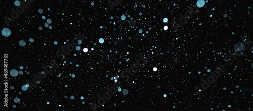 Obraz na plátně Blurred snowflakes on a dark background