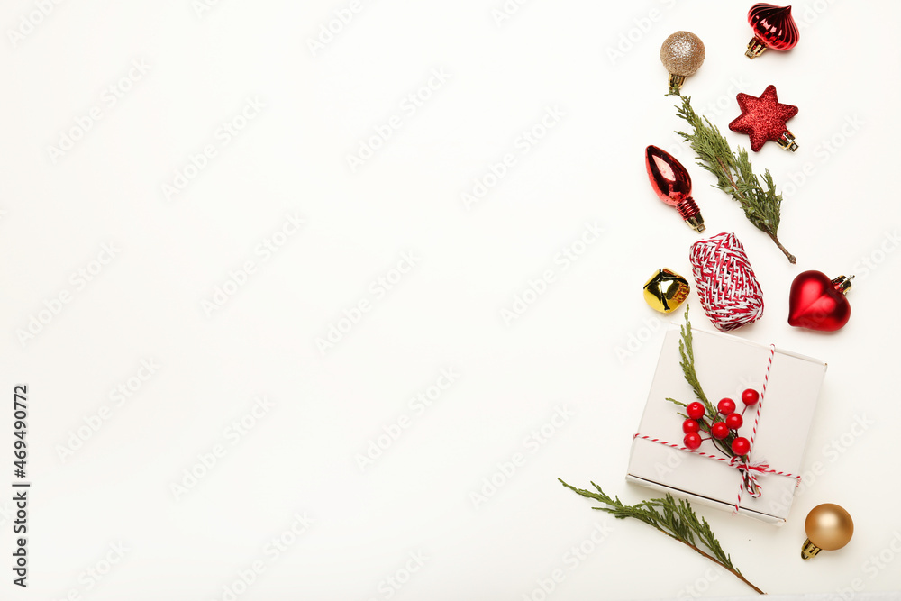 Christmas or Happy New Year composition. Fir tree branches, golden and red decorations on white background. Christmas or Happy New Year composition. Fir tree branches, golden and red decorations on white background.