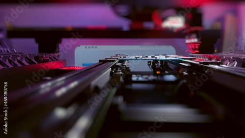 Wallpaper Mural Automatic CNC machine operation: Assemble of system board elements by robotic hand. Technology for the precise installation of semiconductors and electronic components for the production of chips. Torontodigital.ca