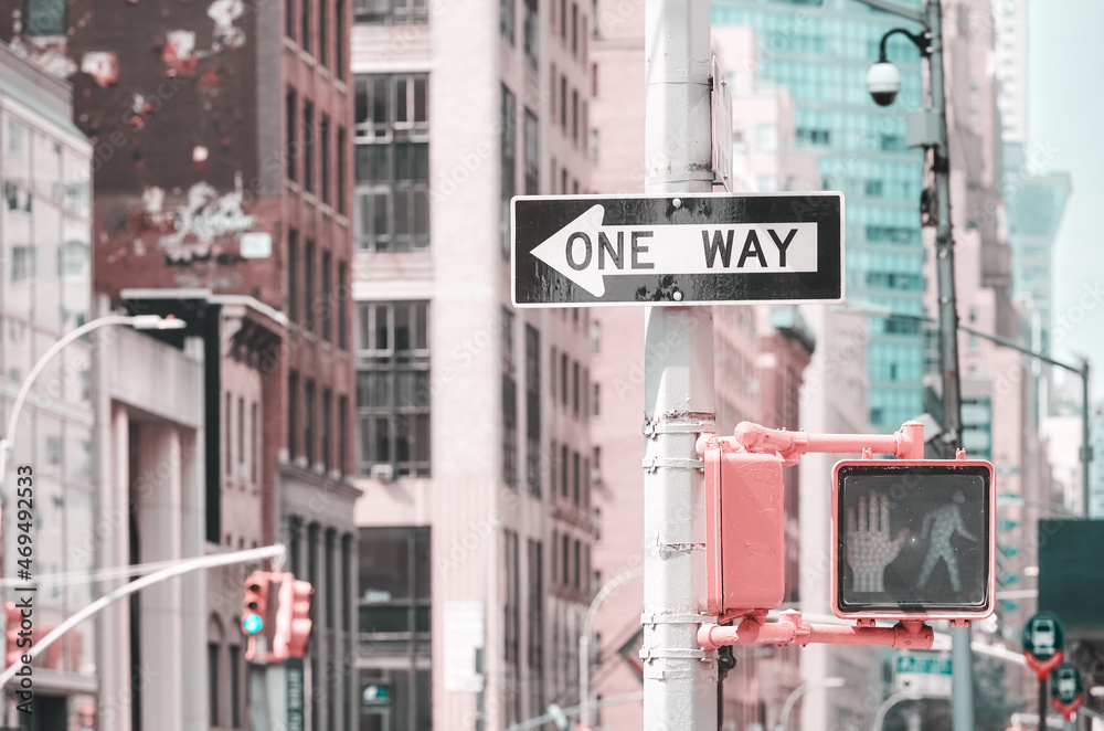 One Way traffic sign, color toning applied, selective focus, New York City, USA.