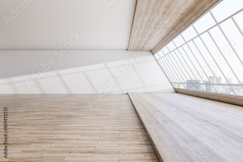 Modern spacious concrete interior with wooden flooring, panoramic city view and daylight. Minimalistic room concept. 3D Rendering.