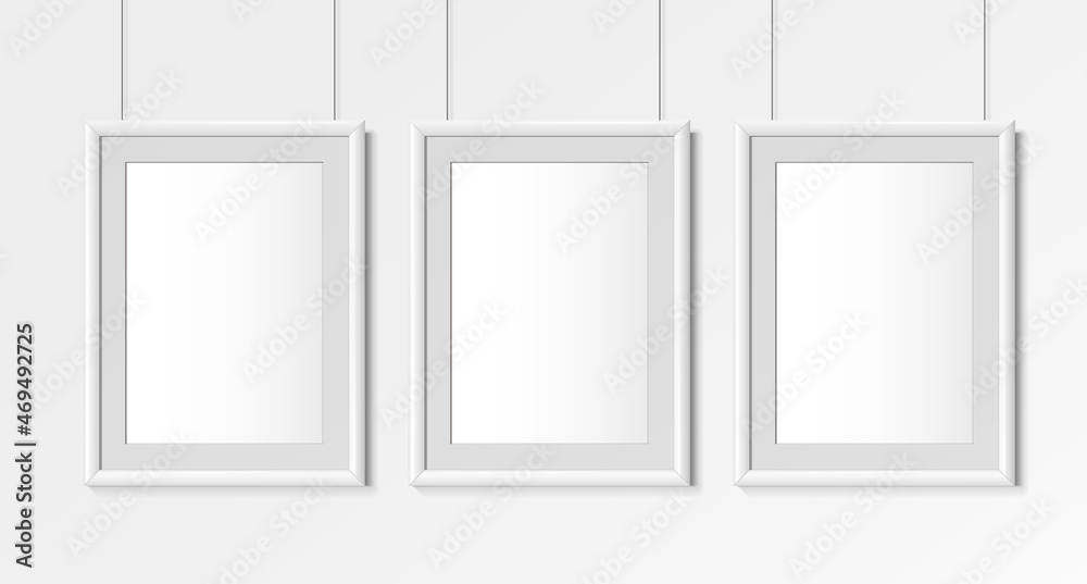Three Realistic white Vertical A4 frames. Posters on wall Mock-up Three Realistic white Vertical A4 frames. Posters on wall Mock-up