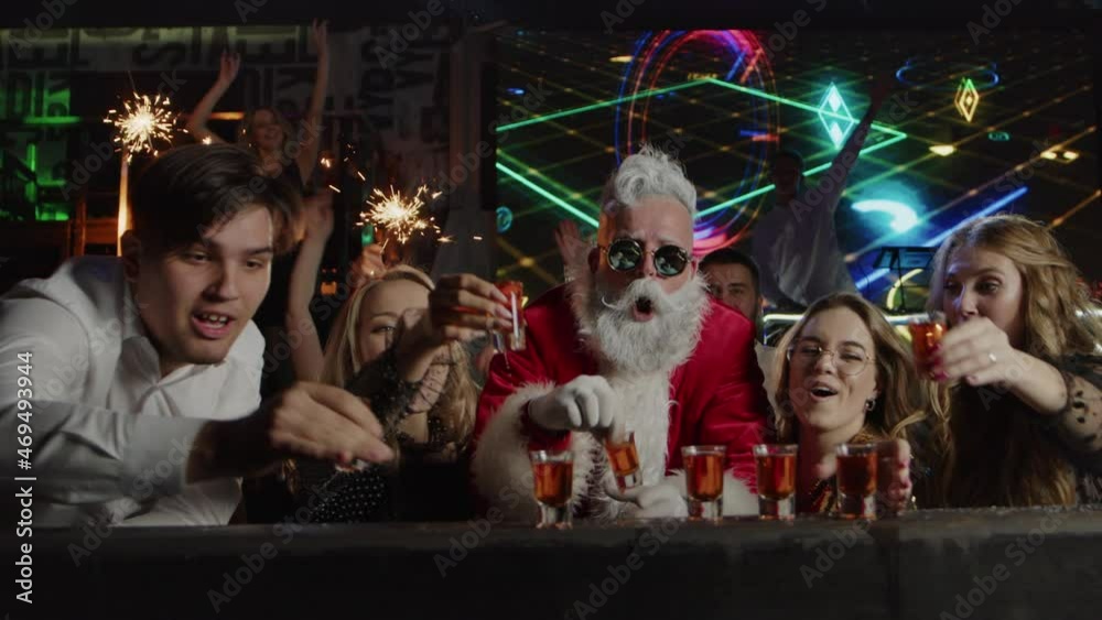 Happy people, Santa Claus drink alcohol at club bar, New Year celebration party