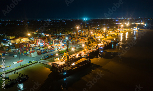 Container ship in export and import business and logistics. at Cambodia . Water transport International. Aerial view