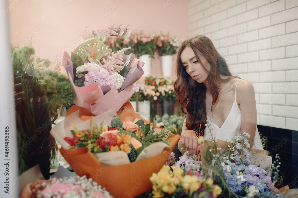 Florist in a flower shop making a bouquet