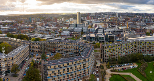 Aerial view of Sheffield city centre skyline and housing developments at sunset