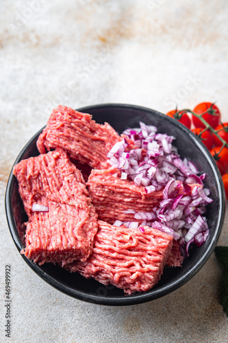 minced meat raw pork, beef or veal, lamb meal snack on the table copy space food background 