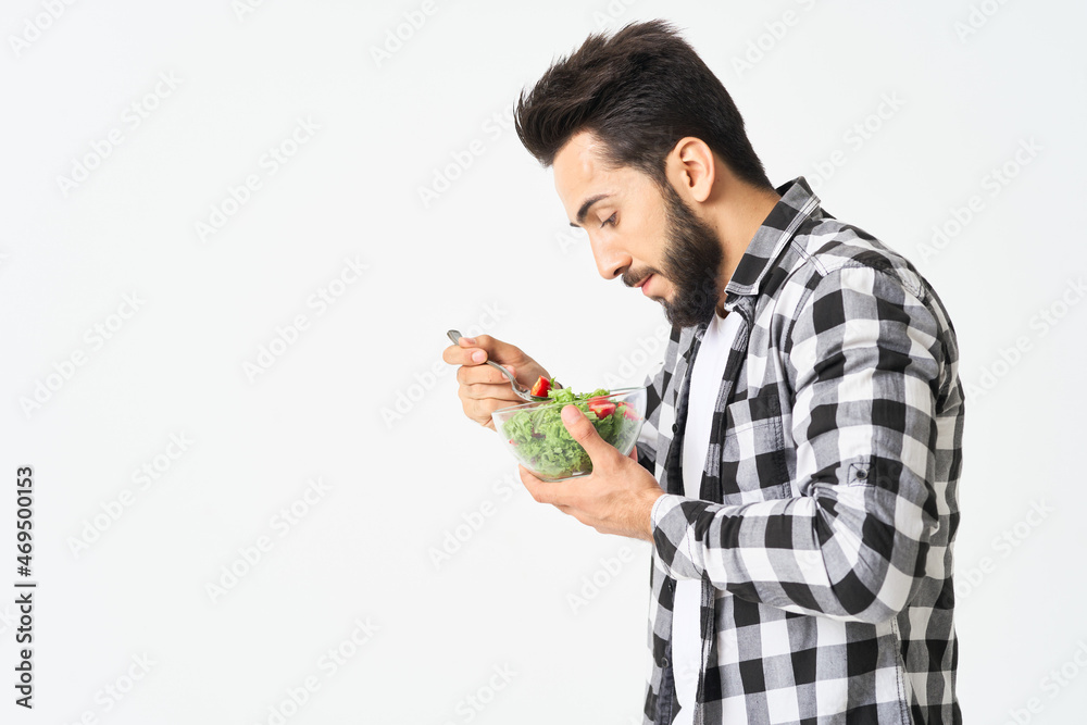 man in plaid shirt eating salad healthy food man in plaid shirt eating salad healthy food