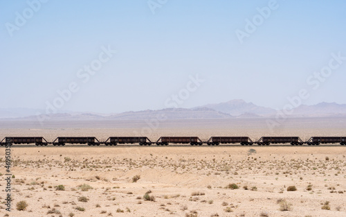 Freight train on desert railway between Esfahan and Mashhad, Iran