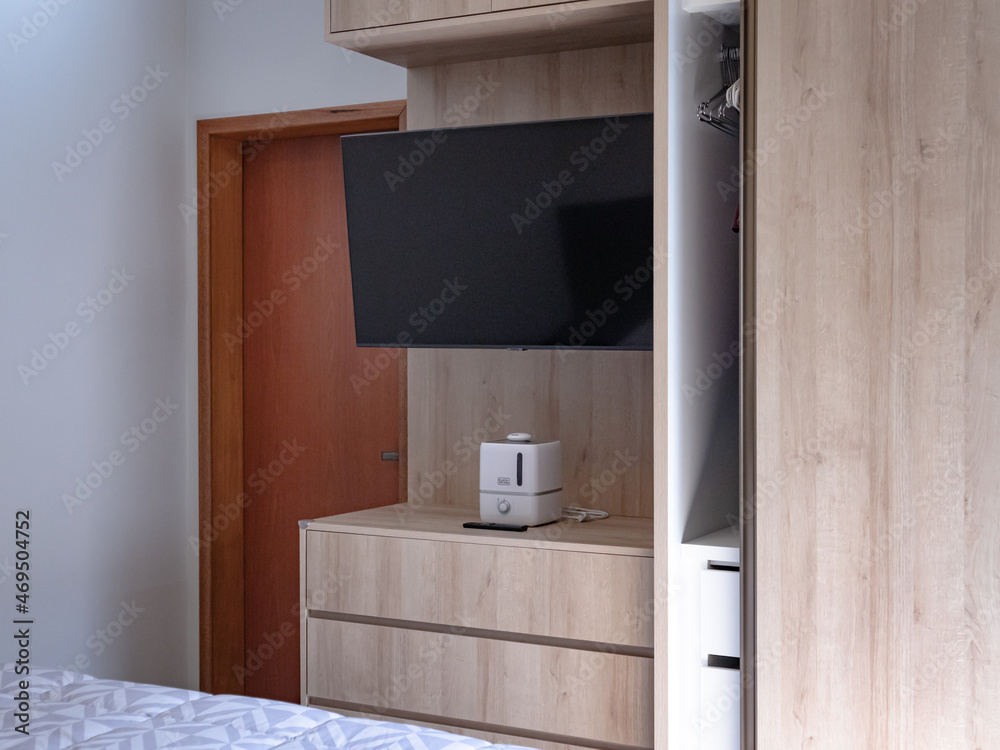 Fototapeta premium wardrobe with TV panel and shoe rack