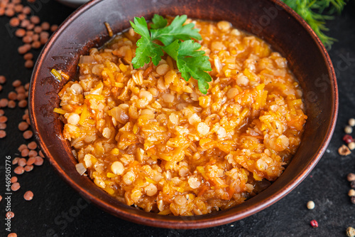 red lentils food vegetable stewed legumes and curry spices ready to eat meal snack on the table copy space food background