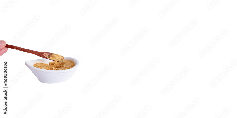 Peruvian maca powder with rustic wooden spoon on a white background. selective focus Peruvian maca powder with rustic wooden spoon on a white background. selective focus