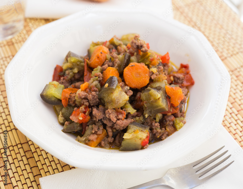 dish of vegetable stew. stewed eggplant, minced meat, carrots, peppers, onion squid dish of vegetable stew. stewed eggplant, minced meat, carrots, peppers, onion squid