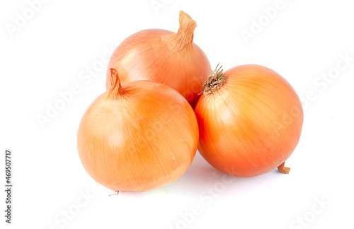 Three fresh onions head isolated on white background.