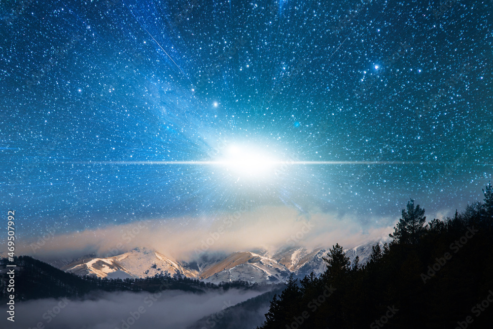 Fantasy night scene, starry sky over the clouds and mountains.