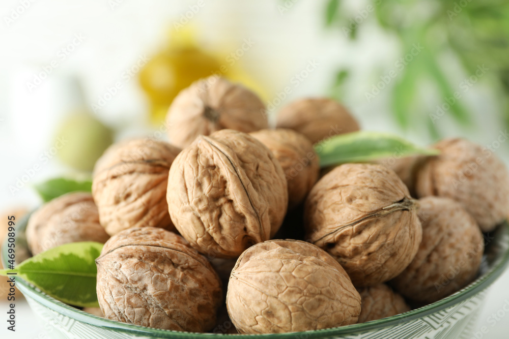 Concept of healthy food with walnuts on white wooden background Concept of healthy food with walnuts on white wooden background