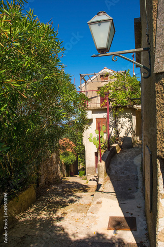 A quiet residential street in the historic hill village of Dobrinj on Krk island in the Primorje-Gorski Kotar County of western Croatia
 photo