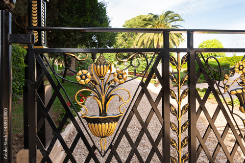 Decorative iron gate on the territory of the Bahai Garden, located on Mount Carmel in the city of Haifa, in northern Israel