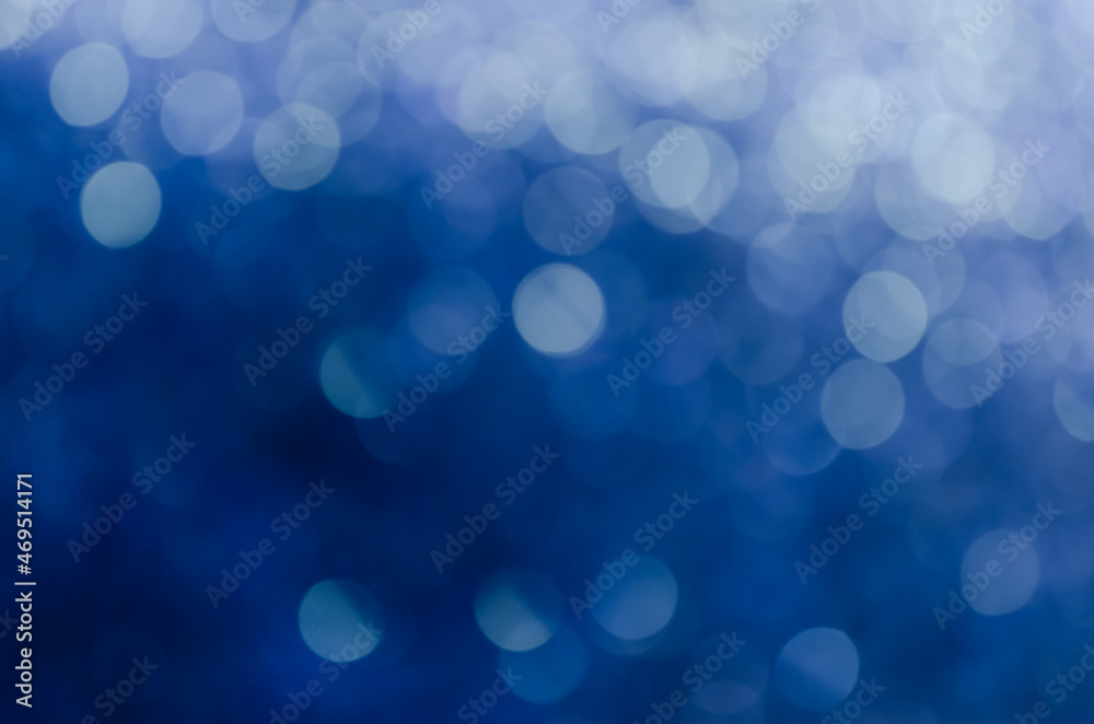 abstract blue bokeh glitter sparkle background.