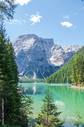 Lake Braies (also known as Pragser Wildsee or Lago di Braies) in Dolomites Mountains, Sudtirol, Italy. Romantic place with typical wooden boats on the alpine lake. Hiking travel and adventure.