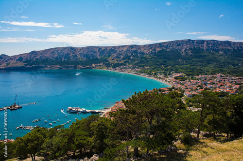 A view of Baska town and bay in the south of Krk Island, western Croatia. Taken from Baska Citadel on a hill overlooking the bay in late summer
 photo