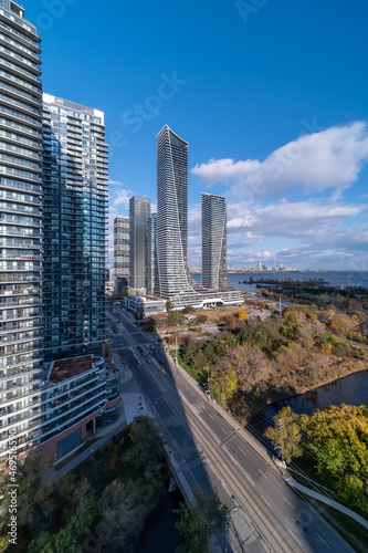 Photography Drone Views of condos and Humber bay shores with  brown trees tops Fall colours