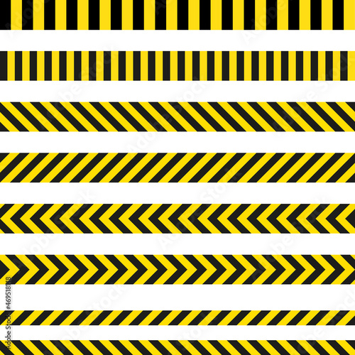 Yellow and black danger ribbons. Police line, crime scene, do not cross, construction site road © zanna_