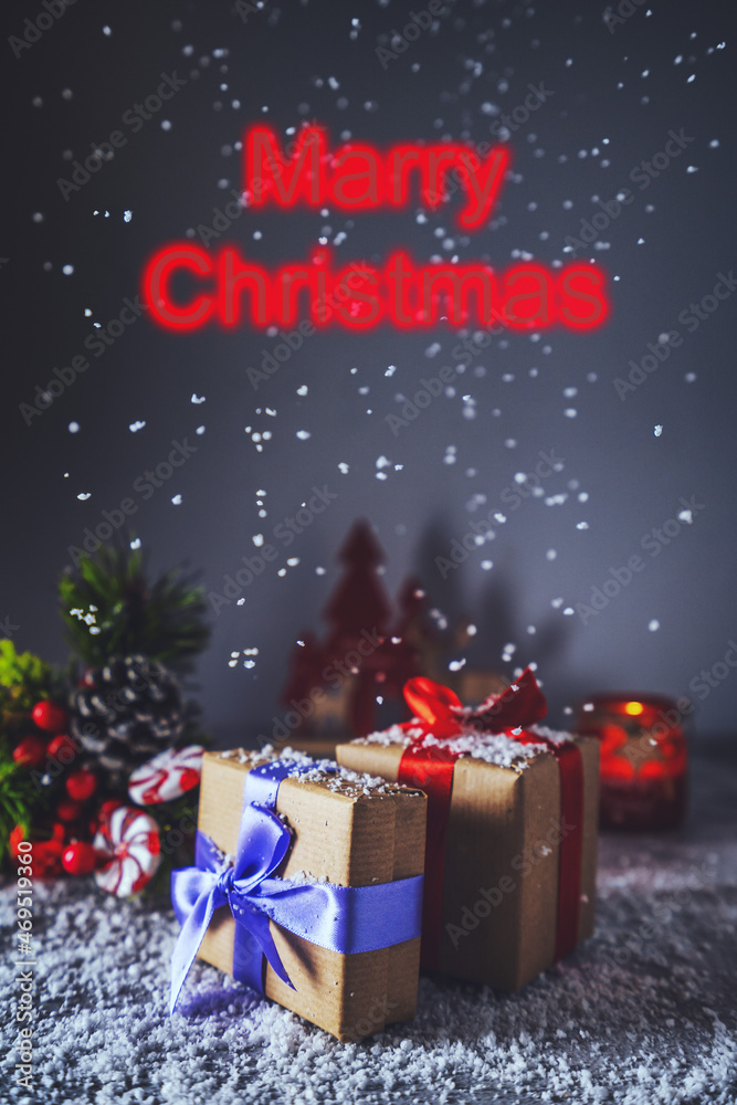 Beautiful Christmas gift boxes on the table whith snow in the room. Snowfall Beautiful Christmas gift boxes on the table whith snow in the room. Snowfall