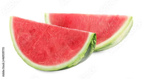 Slices of delicious ripe seedless watermelon on white background