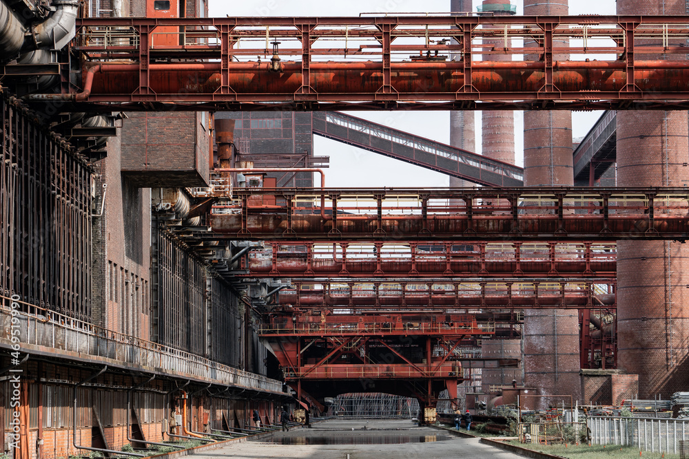 An industrial landscape showcasing a rusted structure with intricate metalwork, highlighting the beauty of decay. The image captures the essence of industrial history and the passage of time. An industrial landscape showcasing a rusted structure with intricate metalwork, highlighting the beauty of decay. The image captures the essence of industrial history and the passage of time.