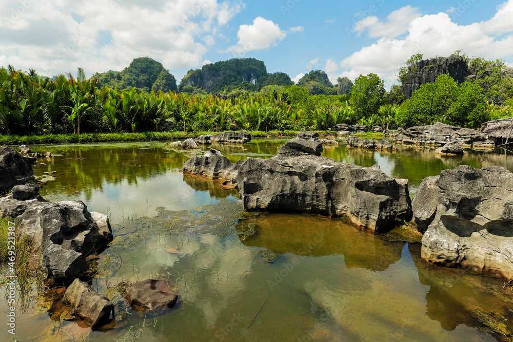 Typical eroded limestone outcrops and lake in karst region, Rammang-Rammang, Maros, South Sulawesi, Indonesia, Southeast Asia, Asia Typical eroded limestone outcrops and lake in karst region, Rammang-Rammang, Maros, South Sulawesi, Indonesia, Southeast Asia, Asia